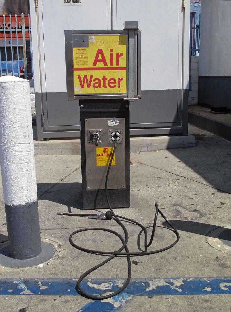 Coin-operated air and water machine at a gas station